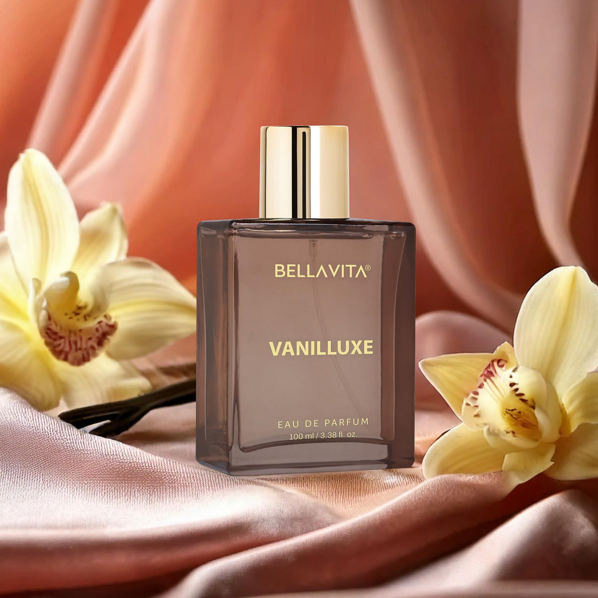 BellaVita Vanilluxe perfume bottle with flowers on a soft fabric background
