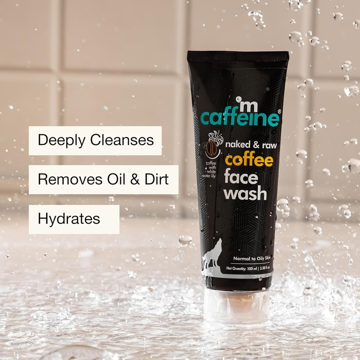 Caffeine coffee face wash tube with water droplets on a tiled background