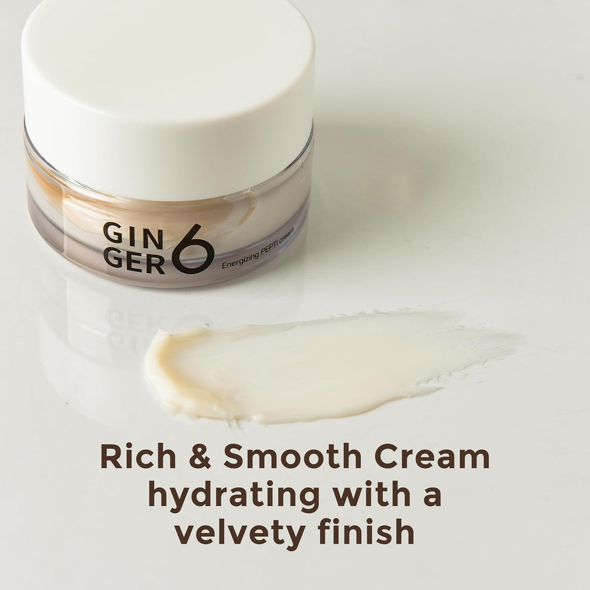 Jar of cream with a swatch on a white background, featuring the brand 'Gin Ger 6'.