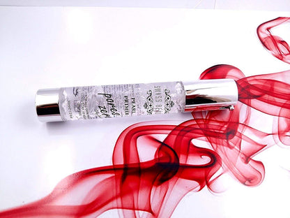 Perfume bottle with red smoke effect on a white background