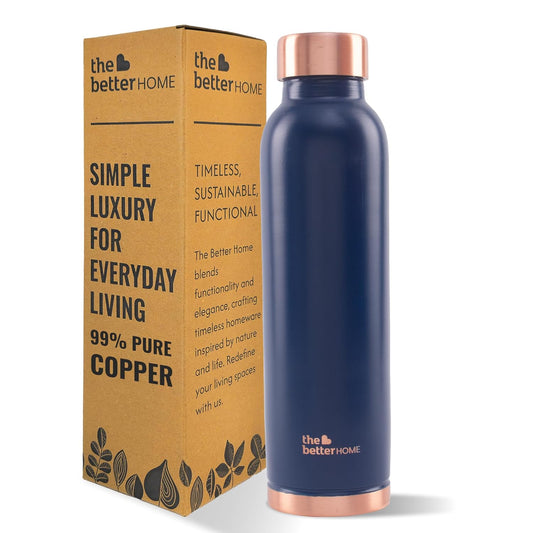 Navy blue copper-infused water bottle with packaging on a white background