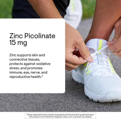 Person tying a white athletic shoe with text about zinc picolinate 15 mg supplement.