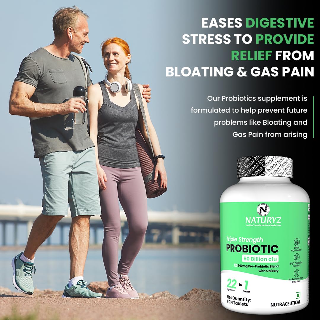 Man and woman walking outdoors with a bottle of Naturyz Probiotic supplement in the foreground.