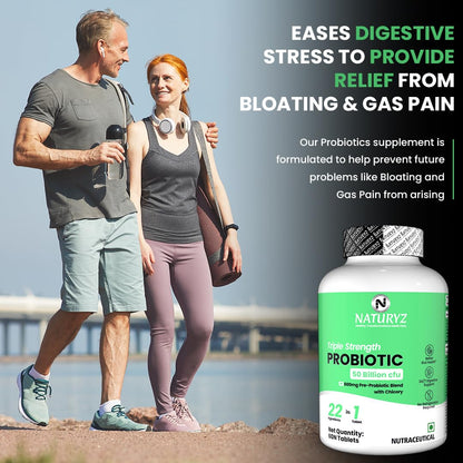 Man and woman walking outdoors with a bottle of Naturyz Probiotic supplement in the foreground.