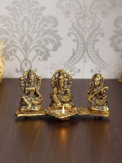 Golden Metal Handcrafted Lakshmi Ganesha Saraswati Idols with Diya On Leaf Chowki - Auspicious Decorative Idols & Diyas for Puja Room, Home, Office, Temple - Gift for Diwali, Housewarming