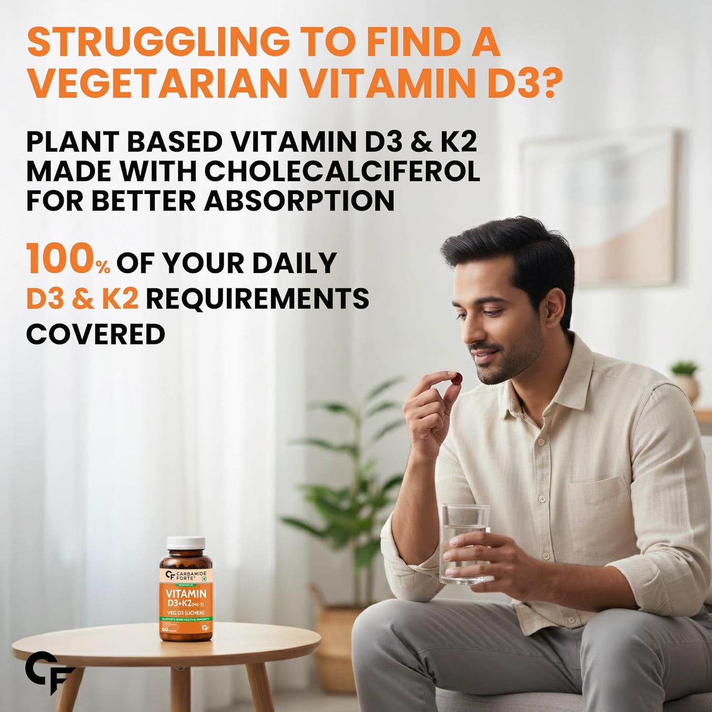 Man holding a glass of water with a bottle of vegetarian vitamin D3 and K2 supplement in a living room setting.