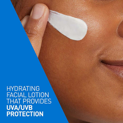 Person applying hydrating facial lotion with UVA/UVB protection on their face.