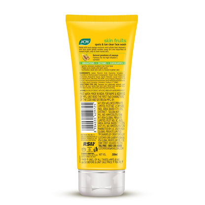 Yellow tube of JOY skin fruits face wash on a white background