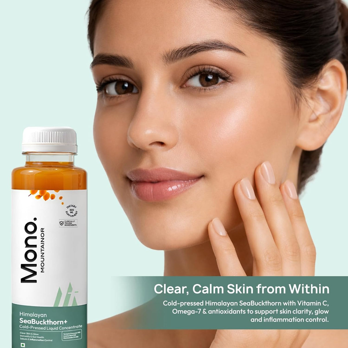 Woman touching her face with a bottle of Mono Mountain skincare product on a light green background