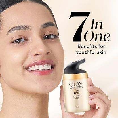 Olay Total Effects 7-in-1 Day Cream with a model holding it, on a beige background.