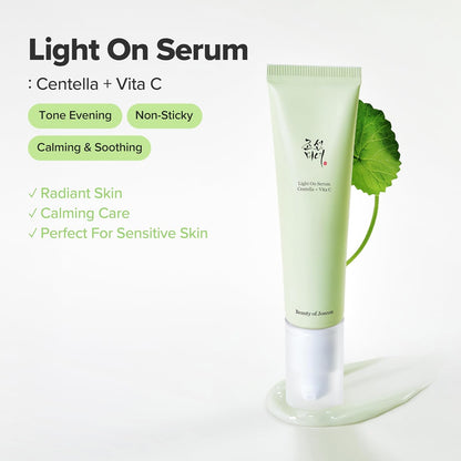 Skincare serum tube with green leaf on a white background