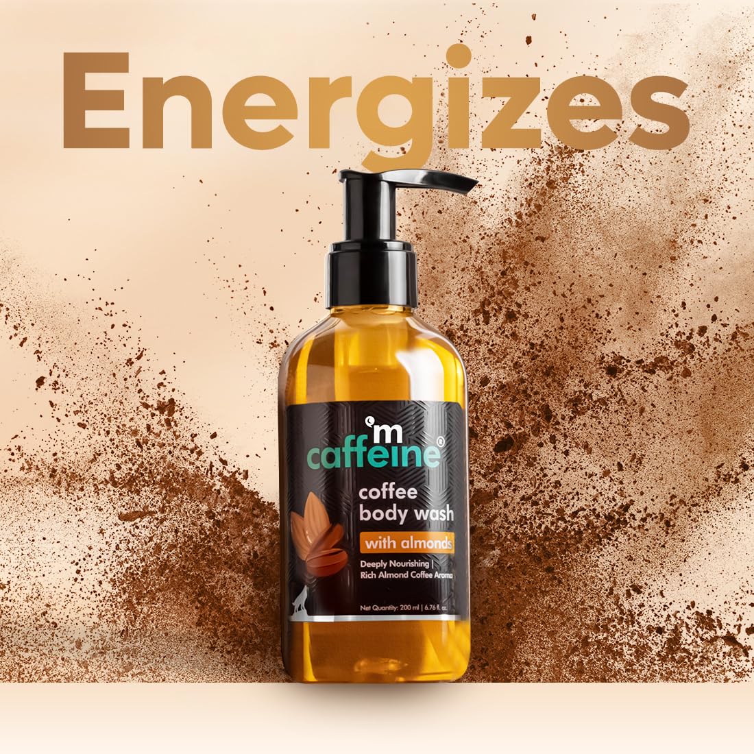 Bottle of coffee body wash with coffee grounds on a beige background