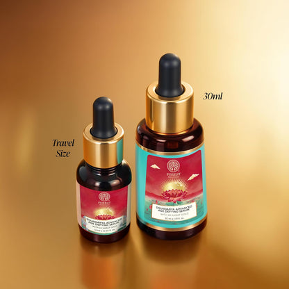 Two bottles of a serum with droppers on a gradient gold background