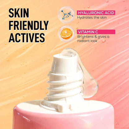 Cosmetic product with text highlighting skin-friendly actives like hyaluronic acid and vitamin C on a gradient background.