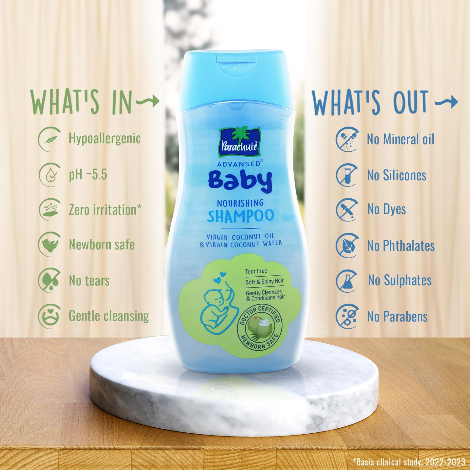 Pantene baby shampoo bottle with features listed on a wooden background