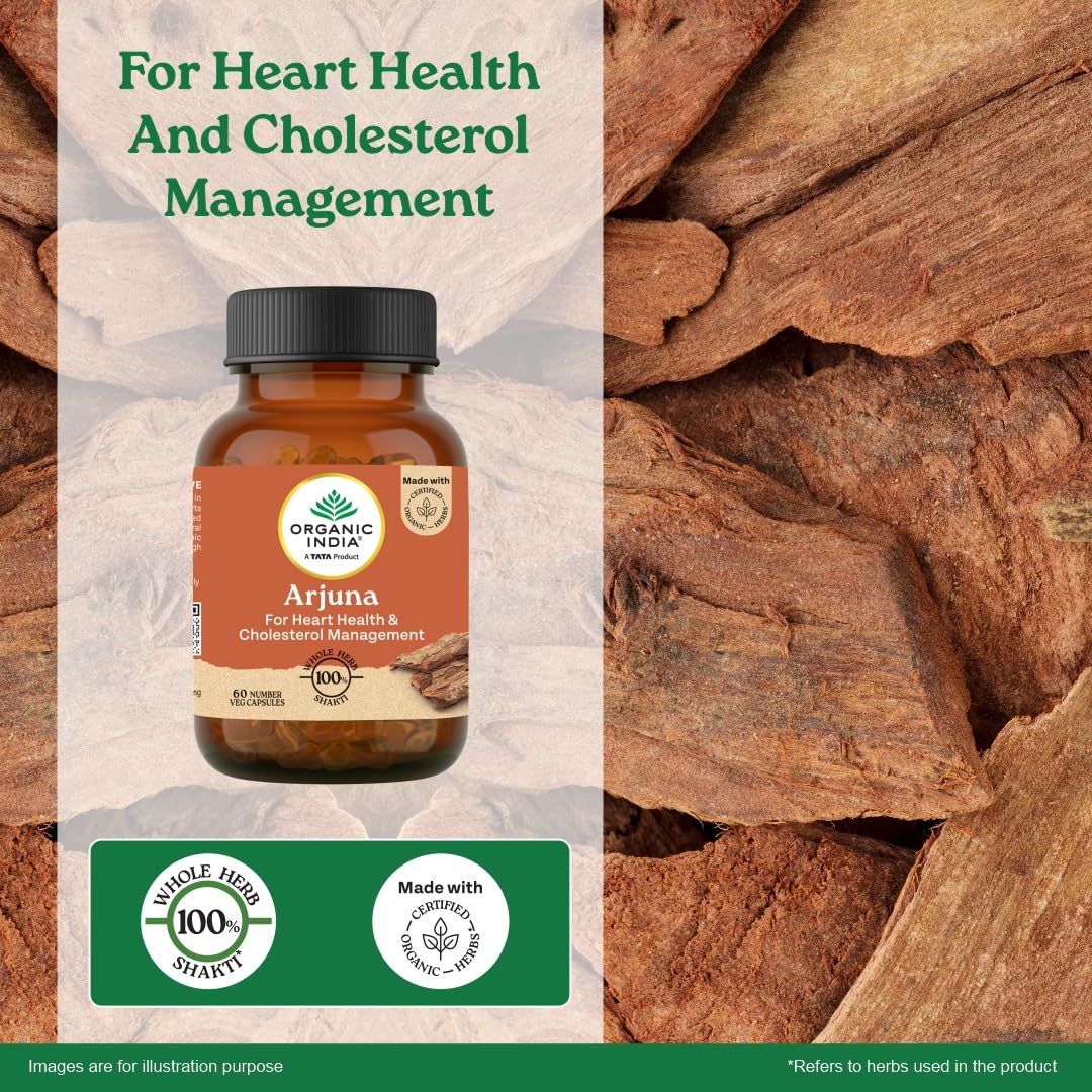 Bottle of Organic India Arjuna supplement with wooden background