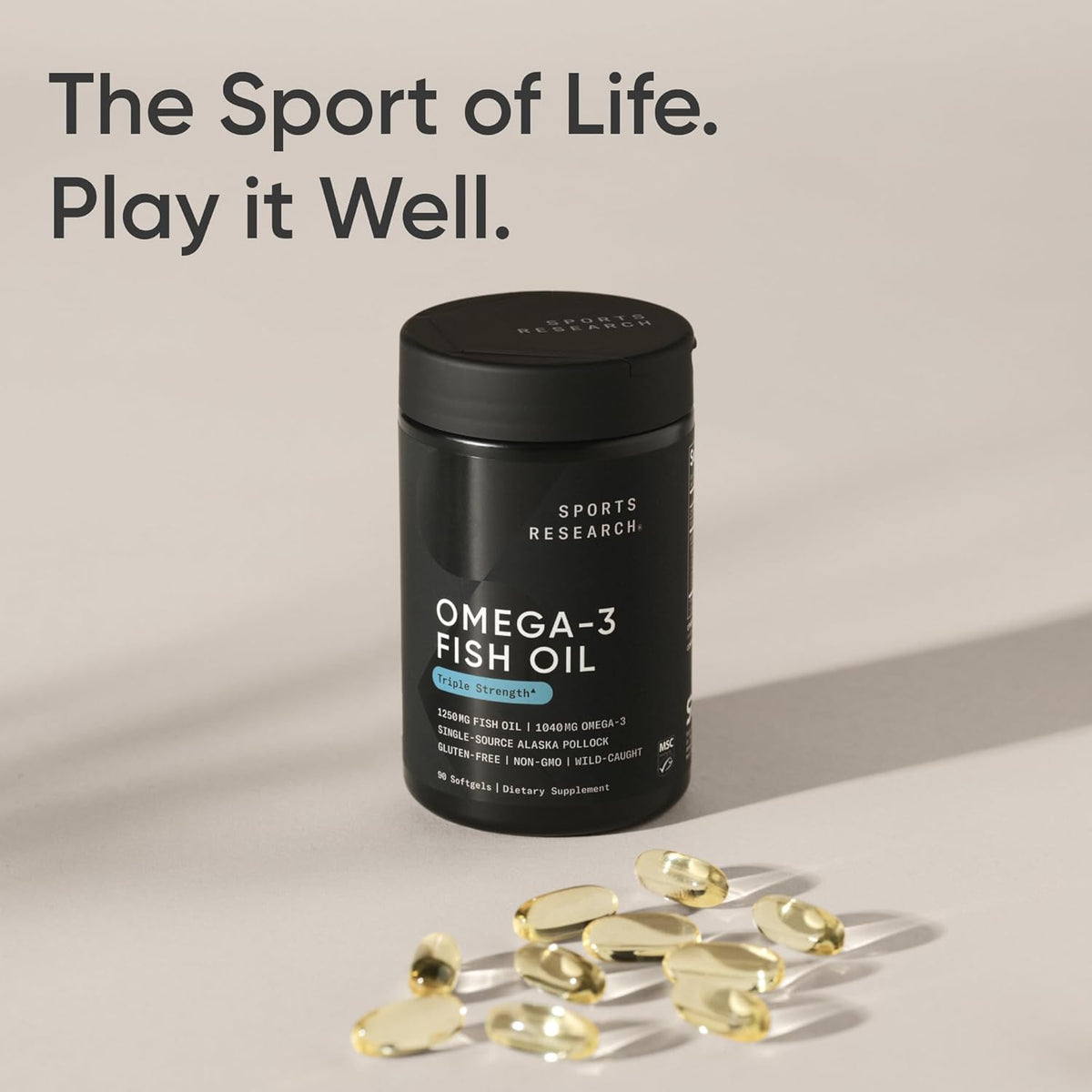 Omega-3 fish oil supplement bottle with capsules on a neutral background, featuring the text 'The Sport of Life. Play it Well.