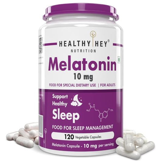 Melatonin supplement container with white pills on a white background