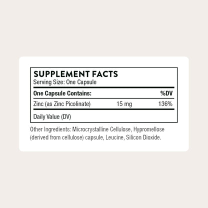 Supplement facts label for a zinc supplement capsule on a light beige background
