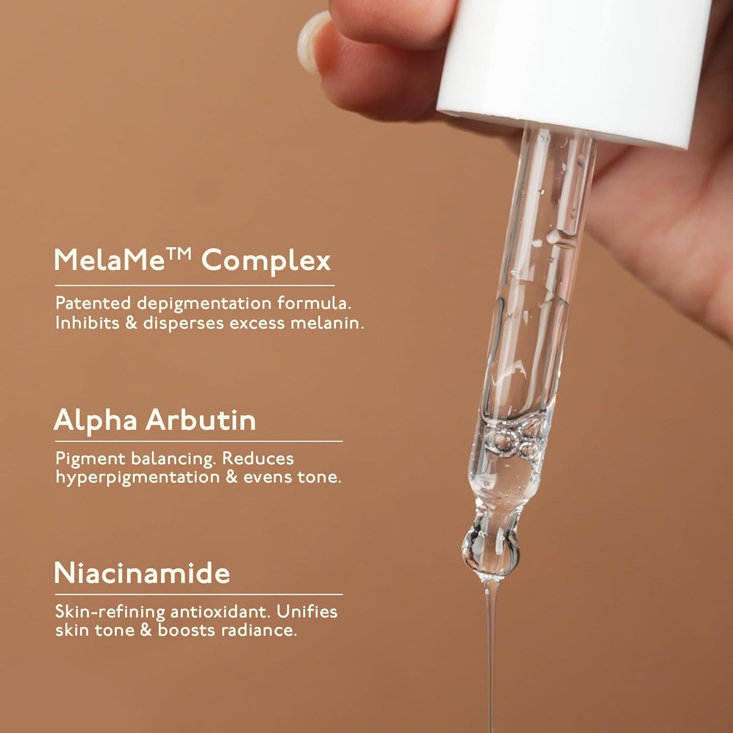 Dropper with skincare ingredients on a brown background