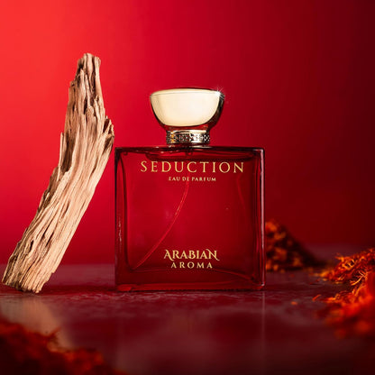 Red perfume bottle labeled 'Seduction' by 'Arabian Aroma' on a red background