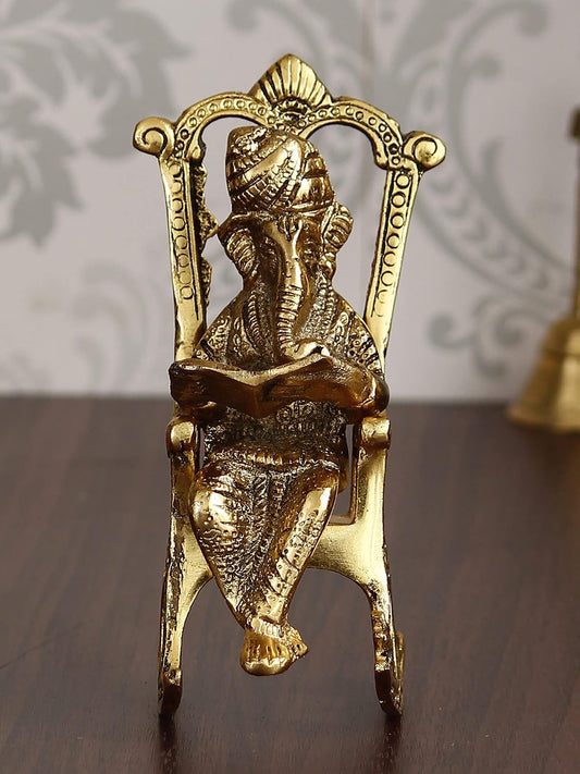 Golden Metal Lord Ganesha Idol Reading Book On Rocking Chair - Decorative Hindu God Statue for Home Decor - Gift for Diwali, Housewarming - Ideal for Living Room, Office, Study Areas
