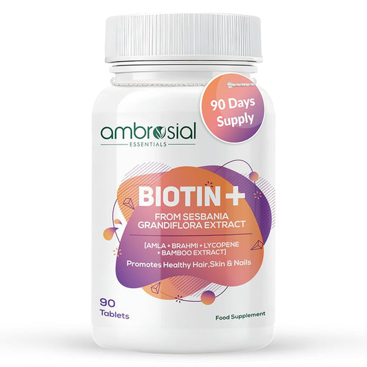 Bottle of ambrosial Biotin+ supplement on a white background