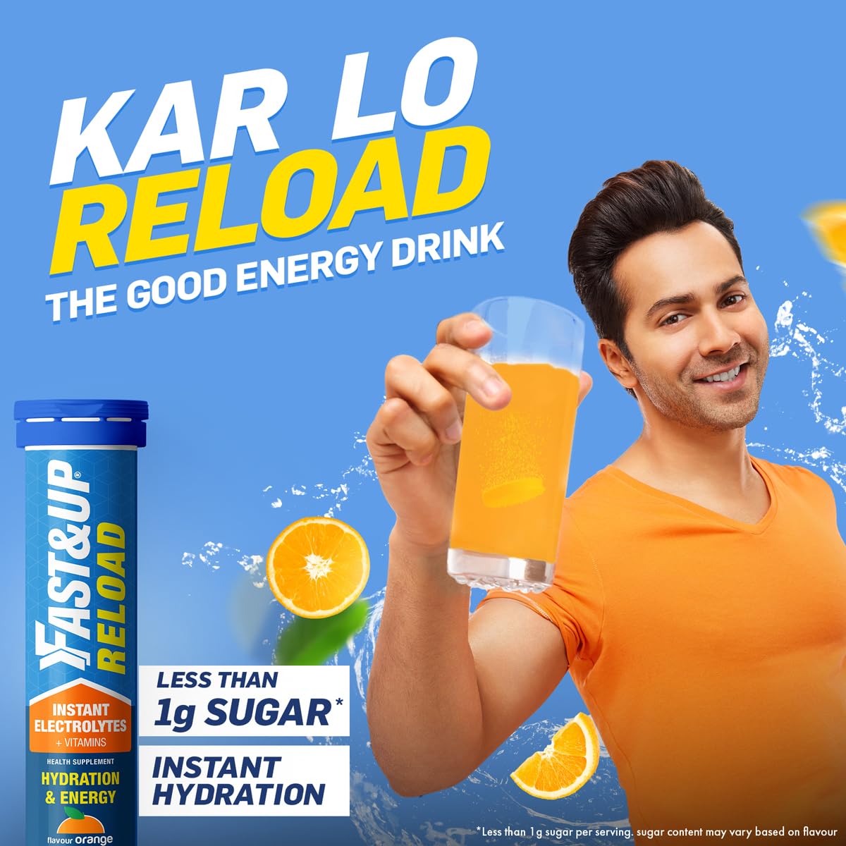 Man holding a glass of orange juice with 'Fast&Up Reload' energy drink packaging on a blue background