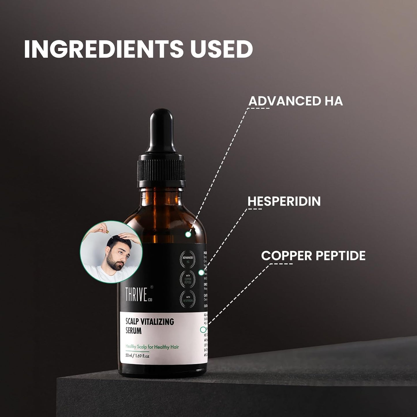 Bottle of scalp vitalizing serum with labeled ingredients on a dark background