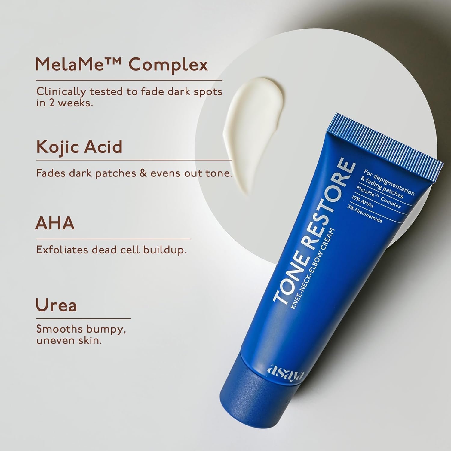 Blue tube of Tone Restore cream with text highlighting its ingredients on a light gray background