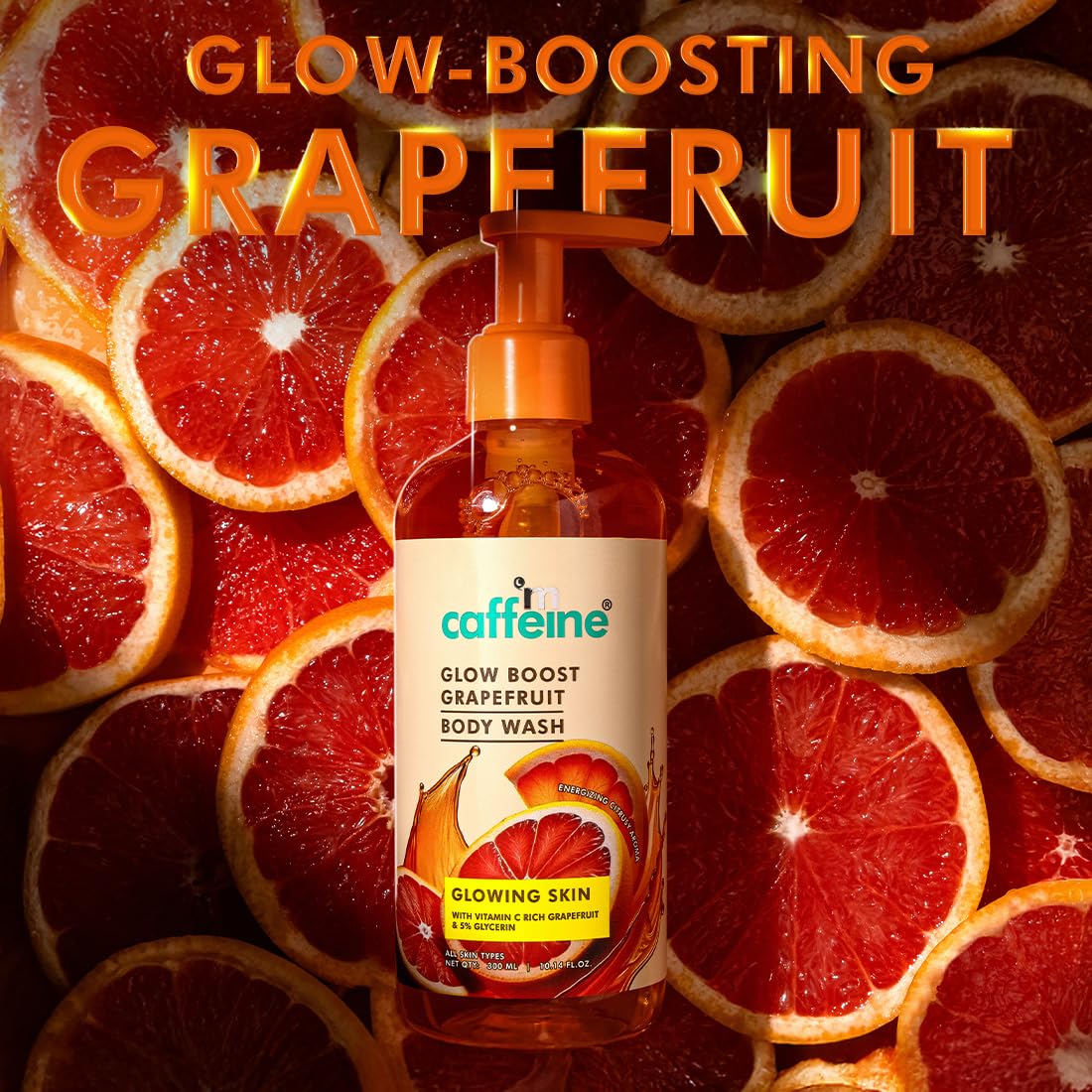 Caffeine Glow Boost Grapefruit body wash bottle with sliced grapefruits in the background