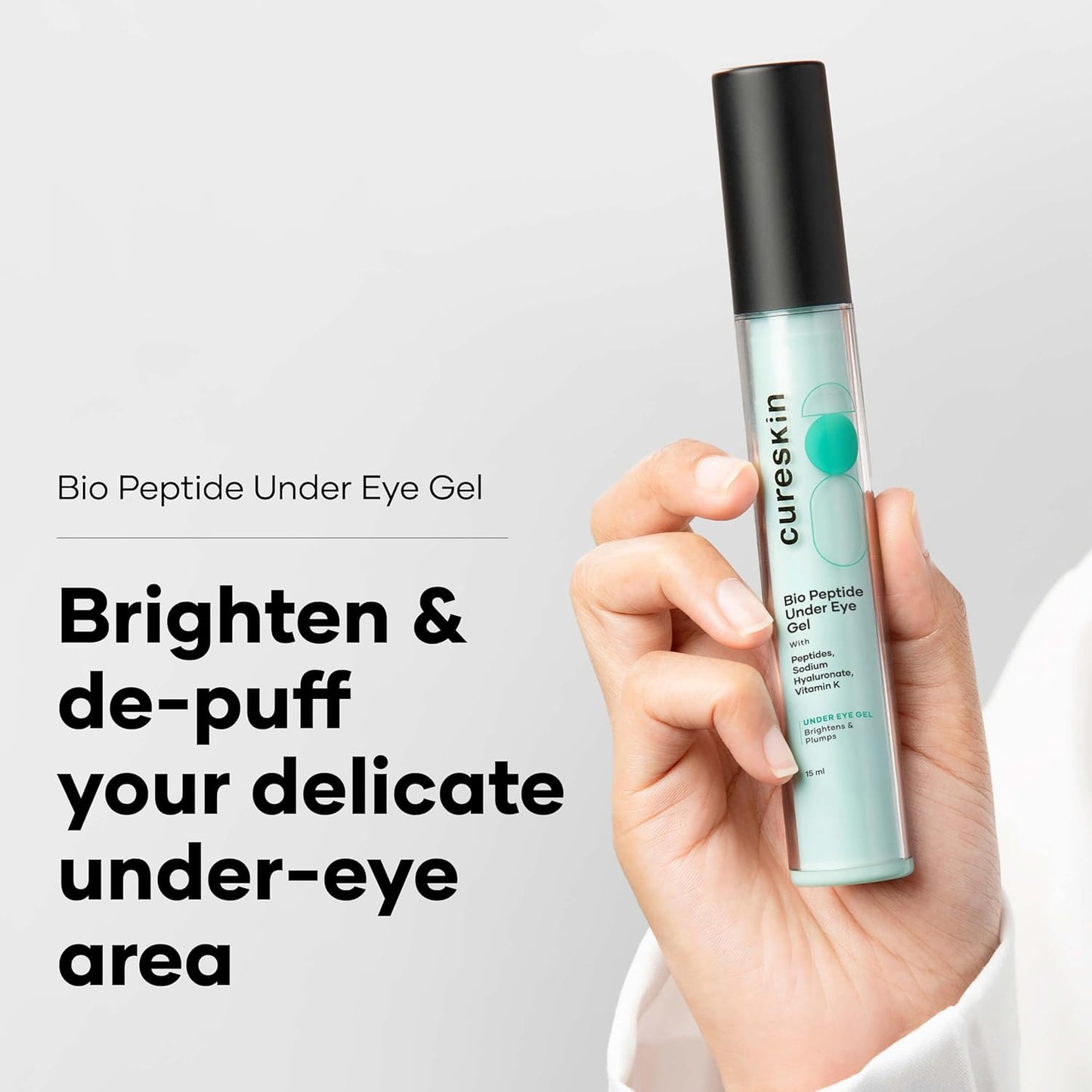 Cureskin Bio Peptide Under Eye Gel held in a hand with promotional text on a light gray background