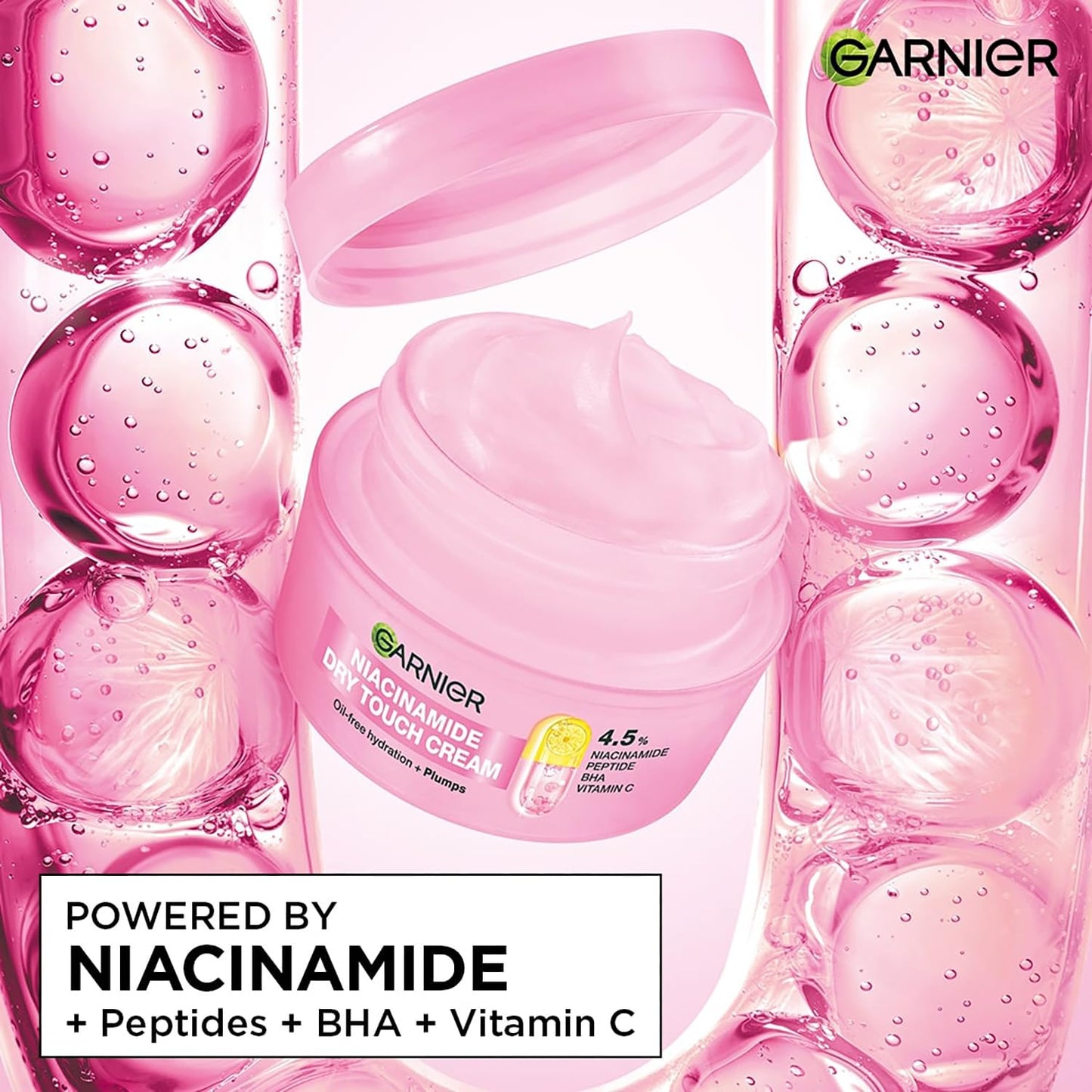 Garnier Niacinamide cream jar surrounded by pink bubbles on a white background