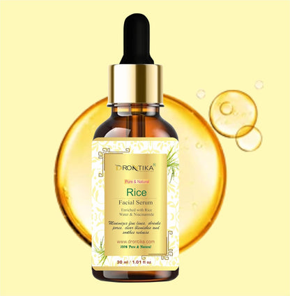 Rice facial serum bottle with dropper on a yellow background