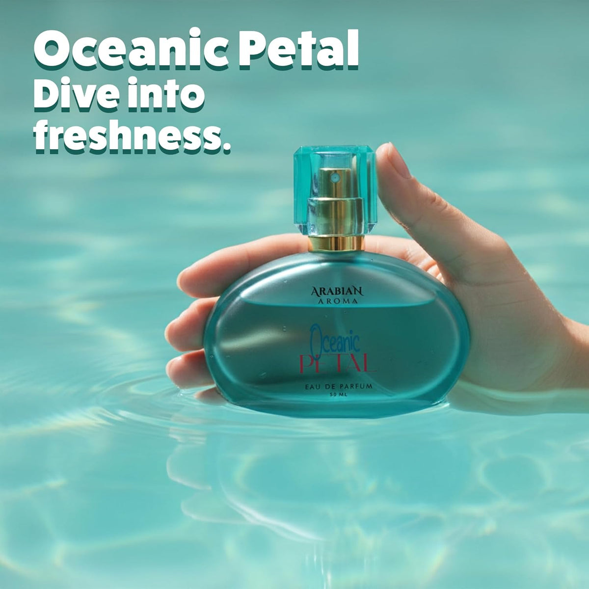 Hand holding a blue perfume bottle with 'Oceanic Petal' text against a water background