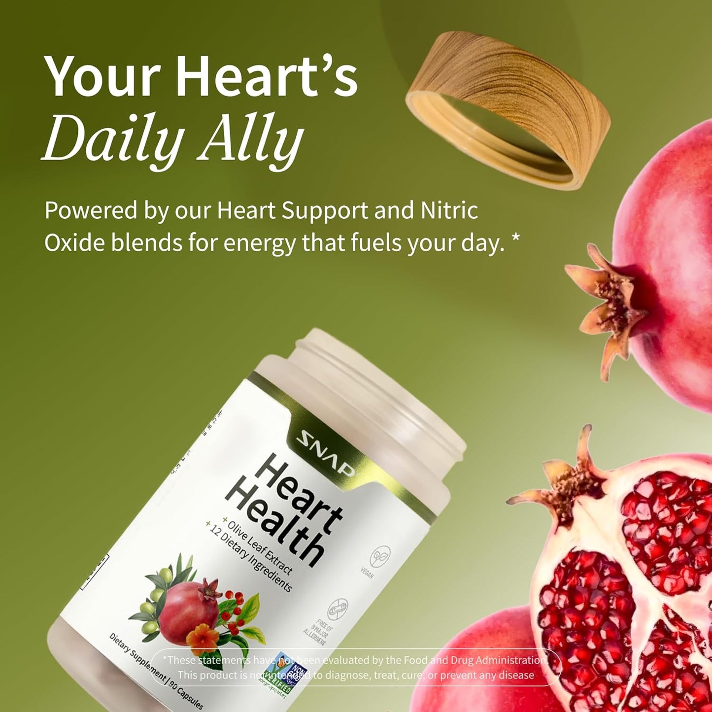 Heart health supplement bottle with pomegranates and a wooden spoon on a green background