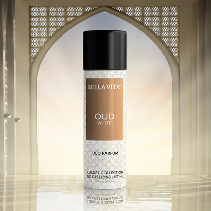 Bellavita Oud White deodorant spray bottle against a decorative arch background