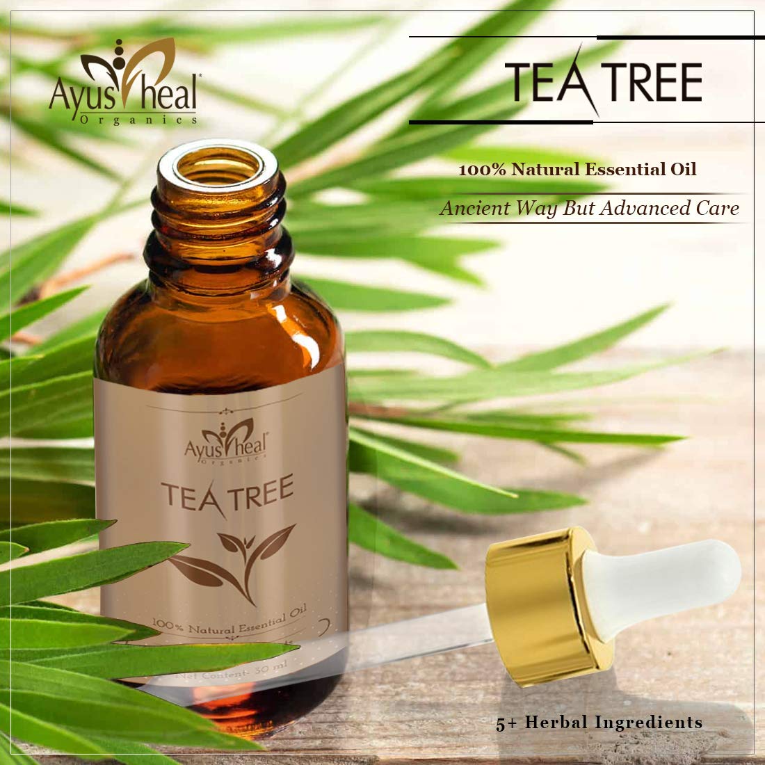 Tea tree essential oil bottle with dropper and leaves on a light background