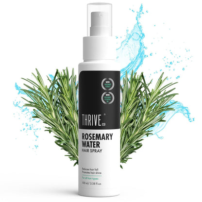 Bottle of Thrive Rosemary Water Hair Spray with rosemary leaves and water droplets on a white background