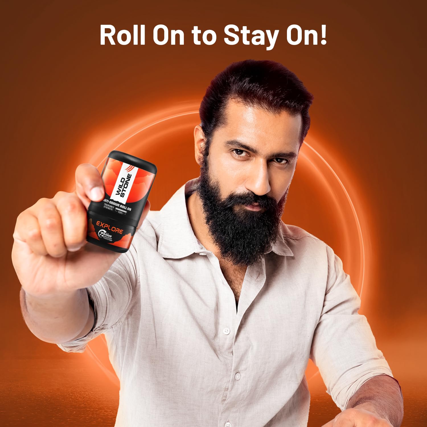 Man holding a product with text 'Roll On to Stay On!' on an orange background