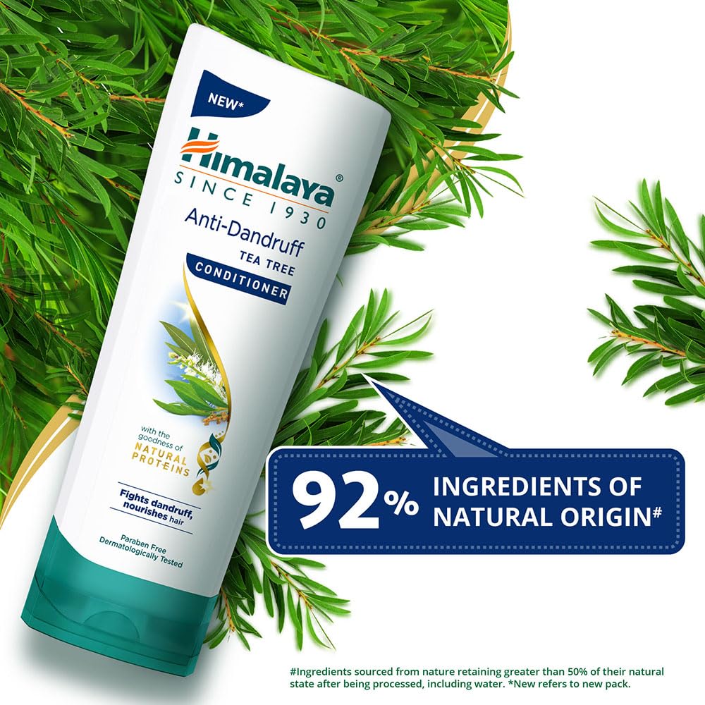 Himalaya Anti-Dandruff Tea Tree Conditioner bottle with green leaves on a white background