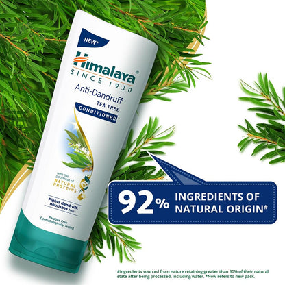 Himalaya Anti-Dandruff Tea Tree Conditioner bottle with green leaves on a white background