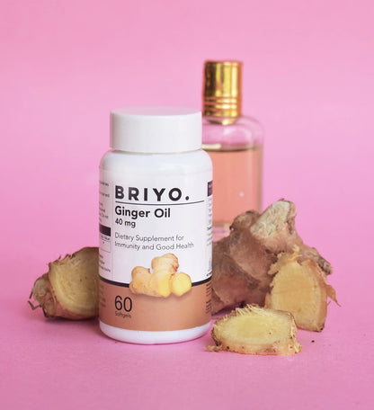 BRIYO Ginger Oil supplement bottle with ginger roots on a pink background