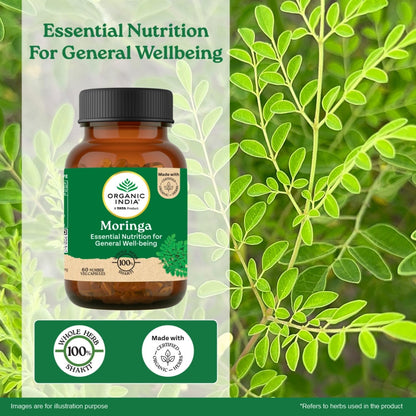 Bottle of Organic India Moringa supplement with green leaves in the background