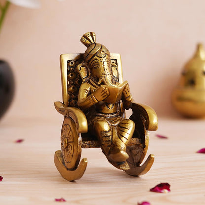 Golden Brass Handcrafted Lord Ganesha Statue Sitting on a Chair and Reading a Book Decorative Showpiece | Divine God Idol for Home, Office Decor, and Gifts