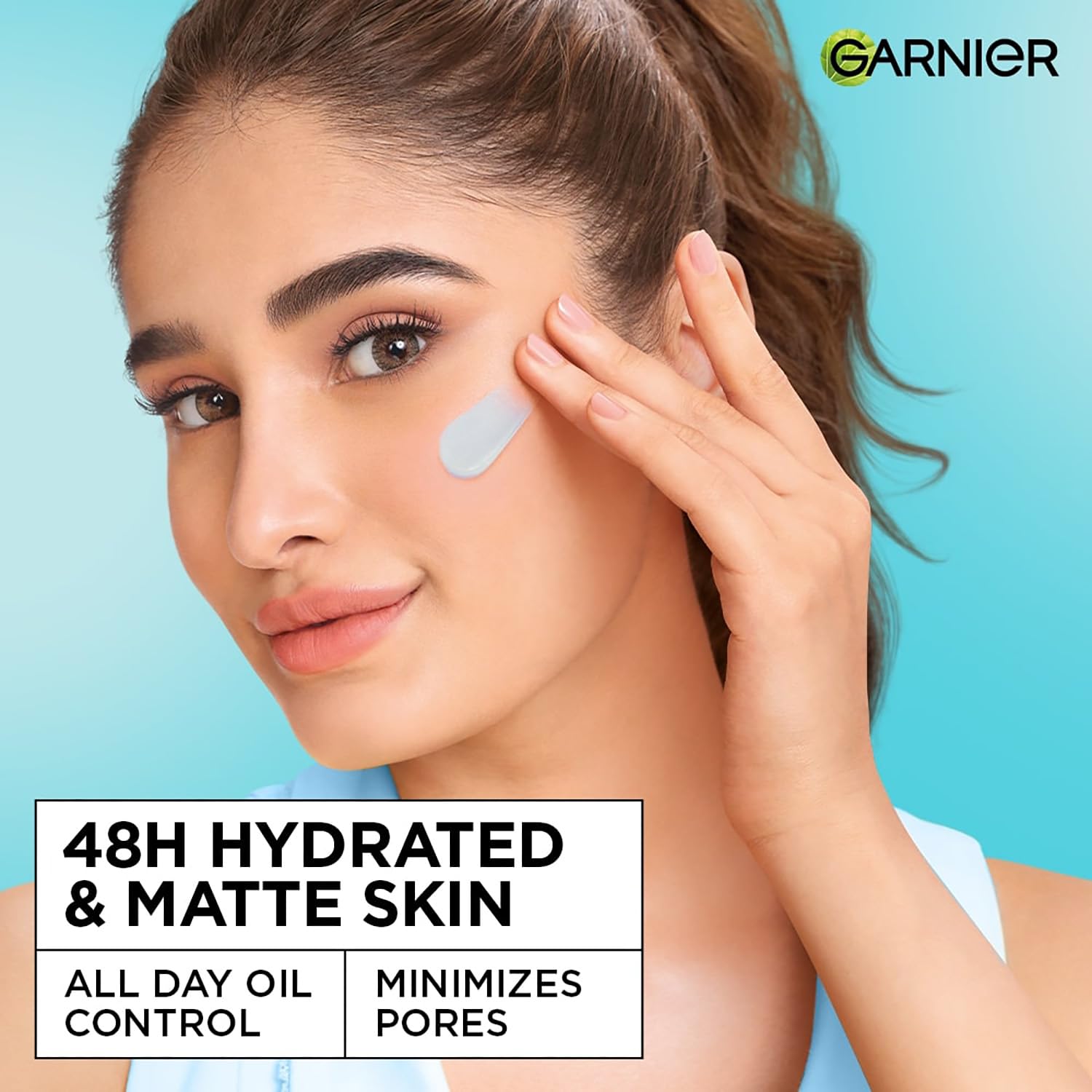 Woman applying skincare product with Garnier logo on a blue background