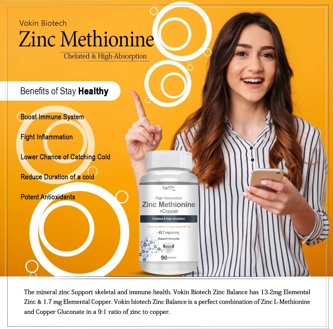 Woman holding a bottle of Vokin Biotech Zinc Methionine supplement with product details on an orange background
