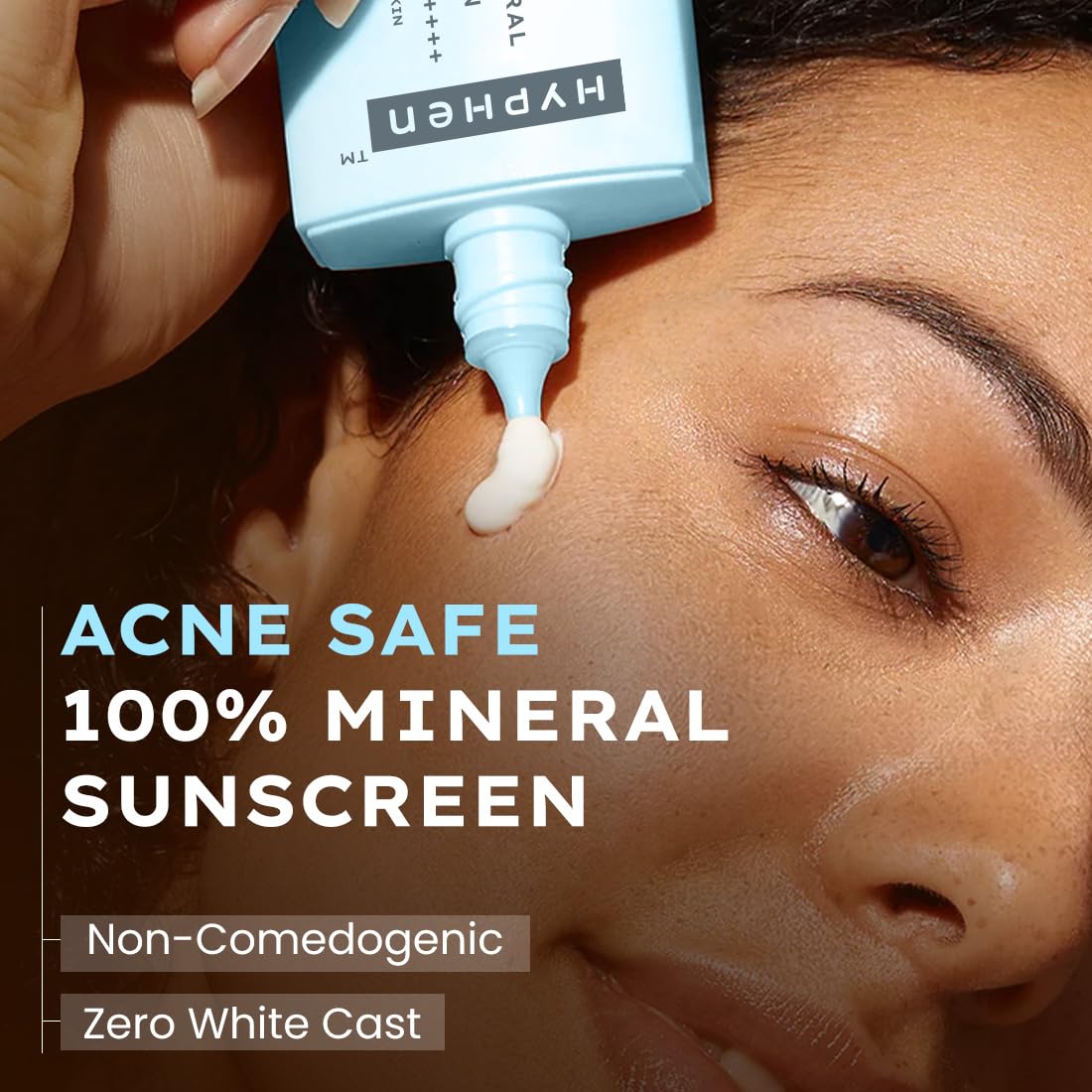 Person applying HYPHEN acne-safe 100% mineral sunscreen to their face.