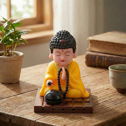 eCraftIndia Moving Head Monk Buddha Idol Showpiece for Home Decor Car Dashboard Office | Feng Shui Spiritual Meditation Buddha Statue Figurine for Good Luck Gift for Housewarming (Plastic, Yellow)