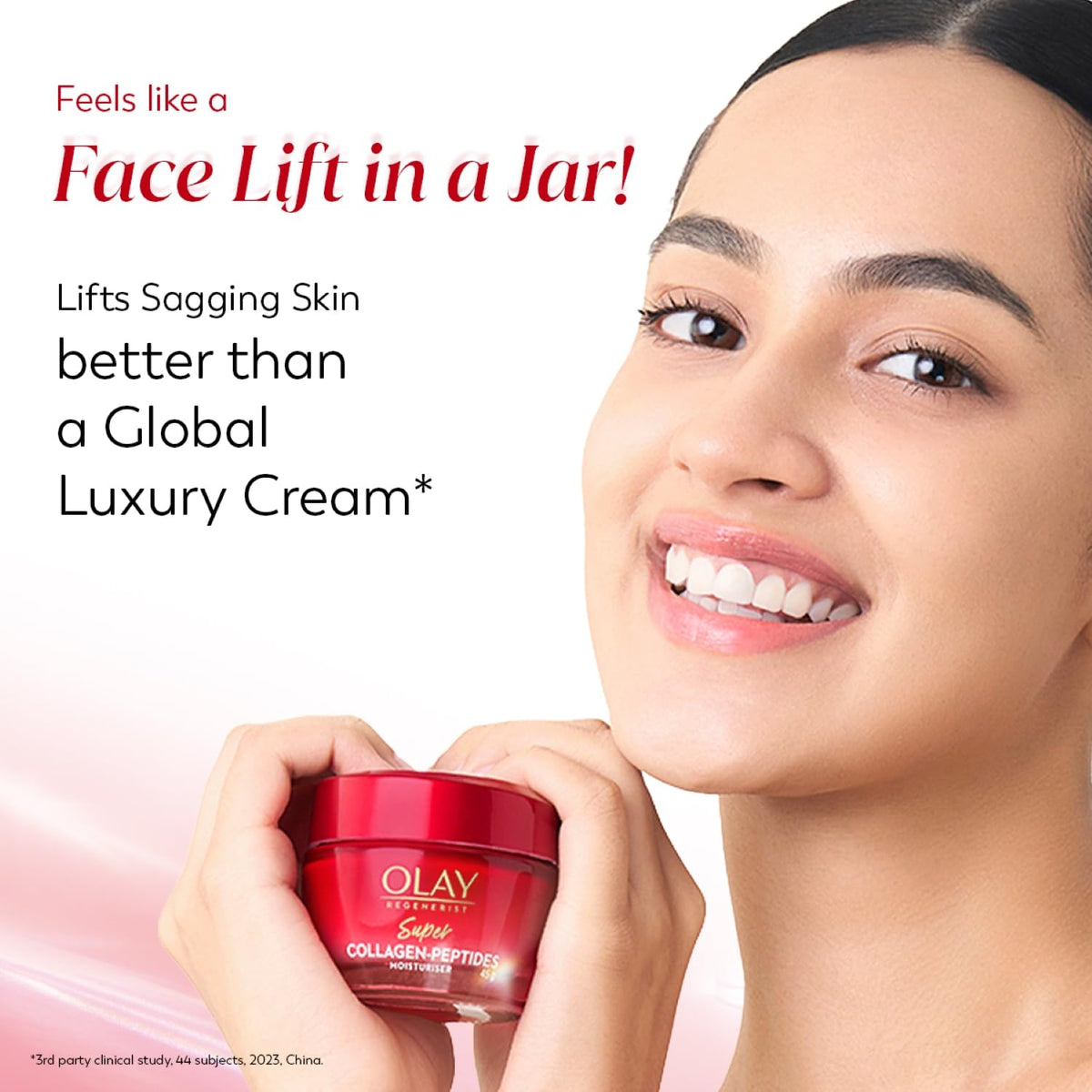 Woman holding a red Olay jar with text about skin care benefits on a light pink background